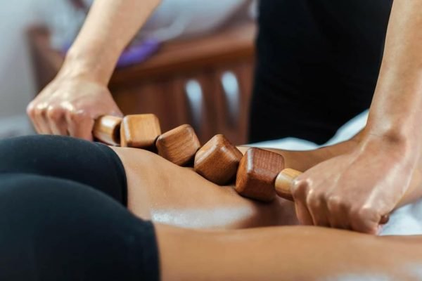 client recieving wood therapy on thighs